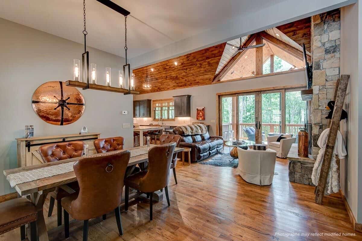 An open layout view of the dining area, living room, and kitchen from the foyer.