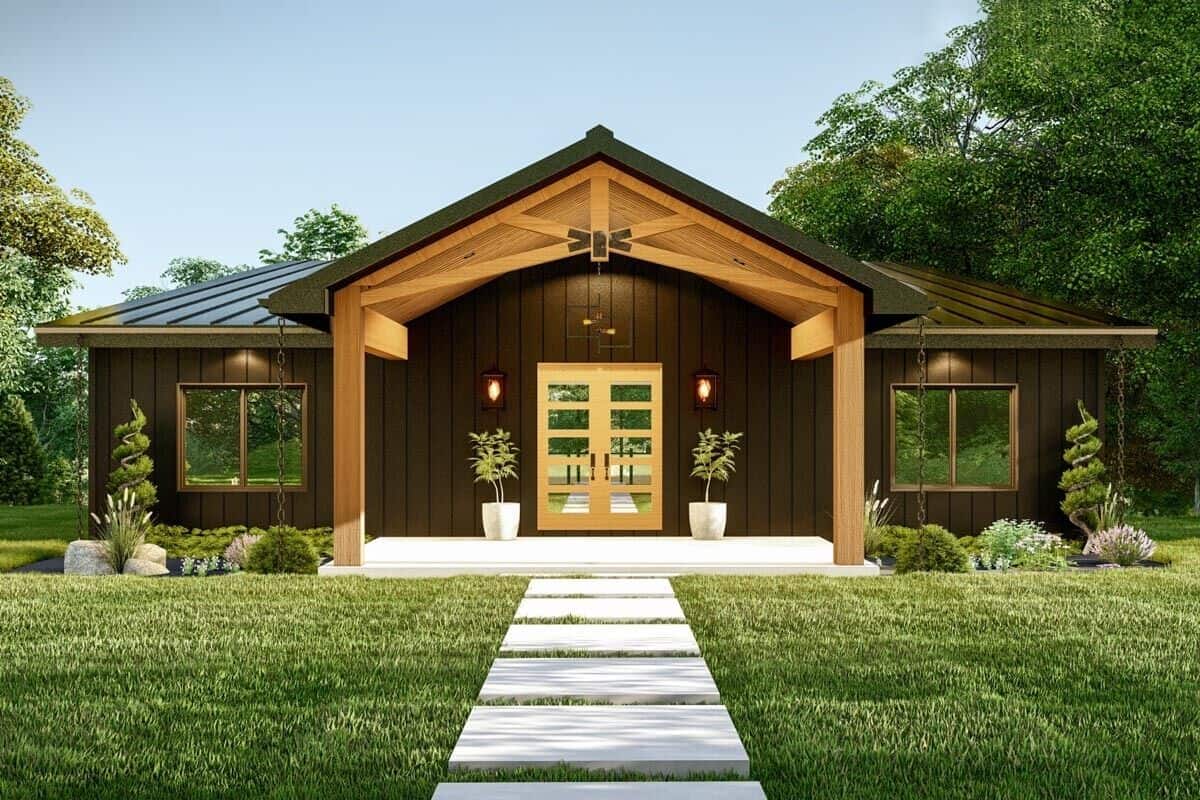 A stone walkway leads to the covered front porch with a French entry door.