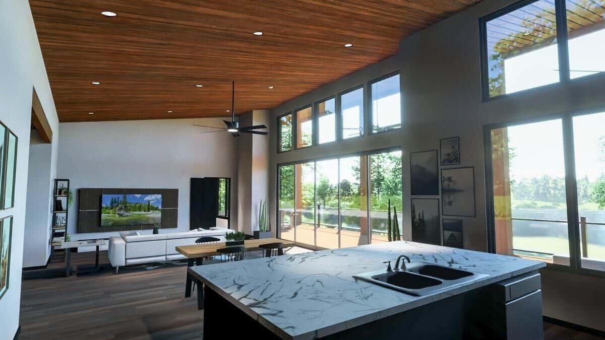 Sliding glass doors extend the living space onto an expansive deck.