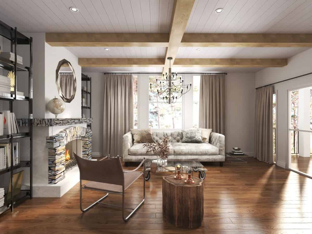 The keeping room features a beamed ceiling and a stone fireplace topped with a decorative mirror.