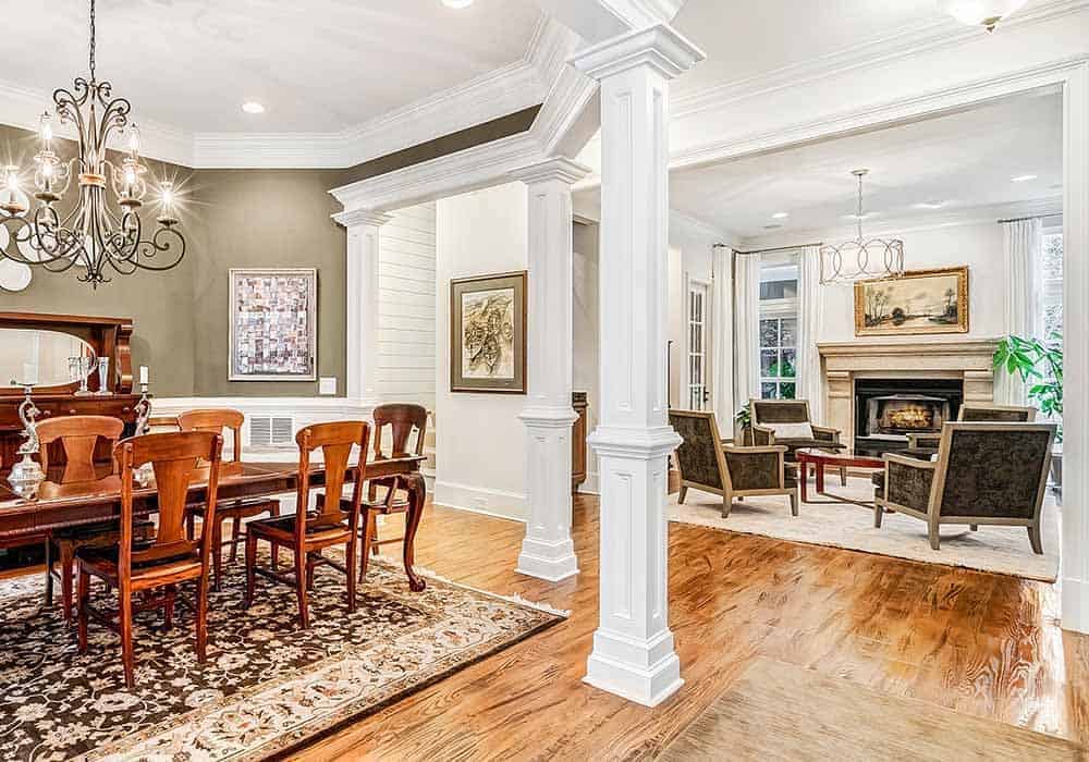 Decorative columns define the dining room in the open floor plan.