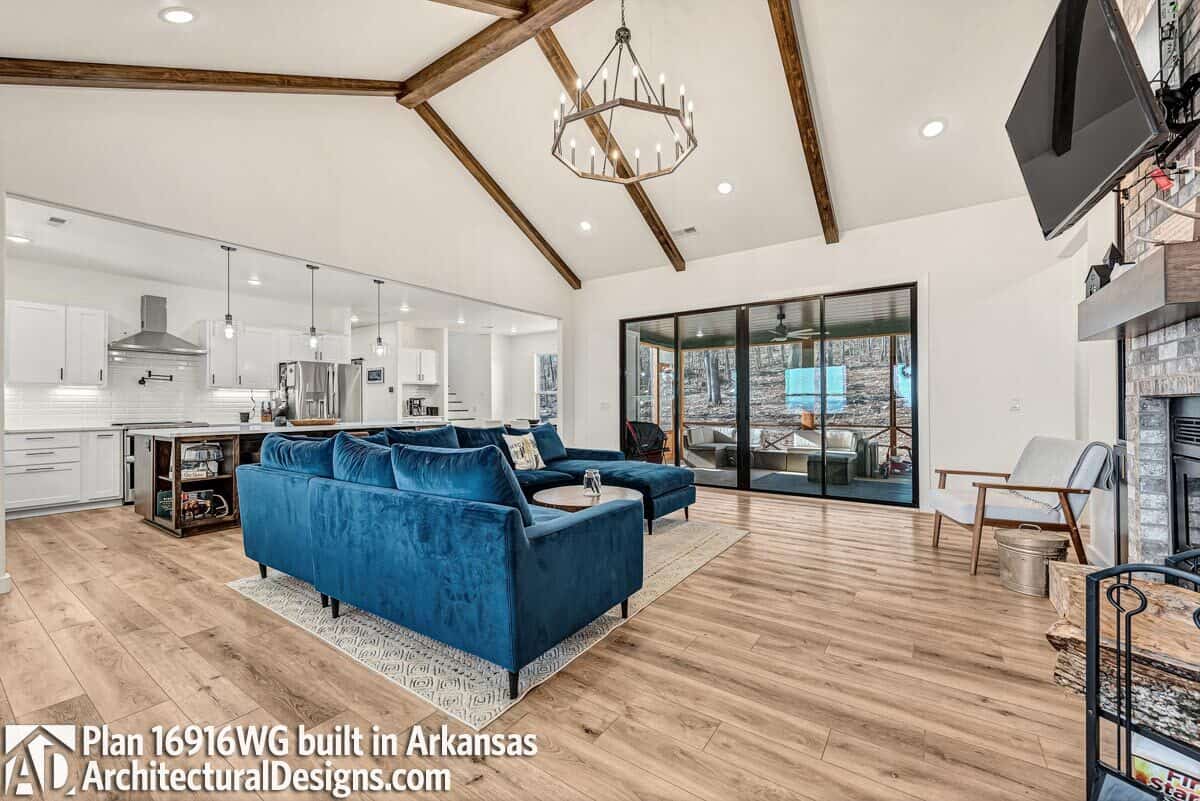 A vaulted ceiling highlighted by exposed beams crowns the family room.