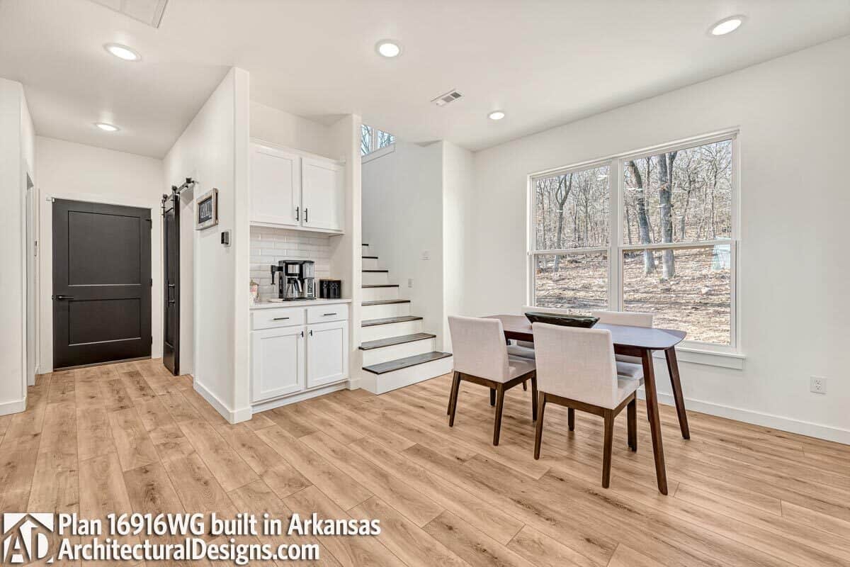Breakfast nook with a built-in bar and a view of the backyard.