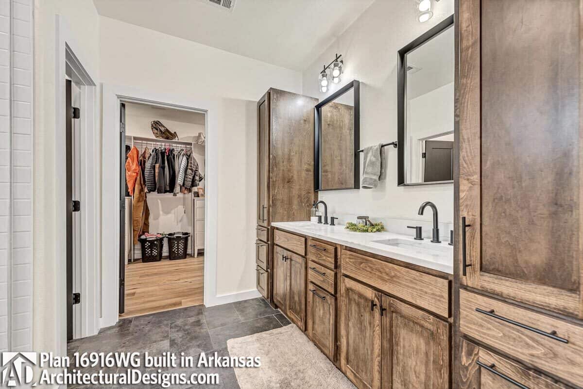 The primary bathroom offers a dual sink vanity and a walk-in closet.