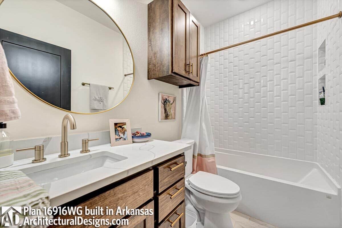 The shared bathroom is equipped with a single sink vanity, a toilet, and a tub and shower combo.