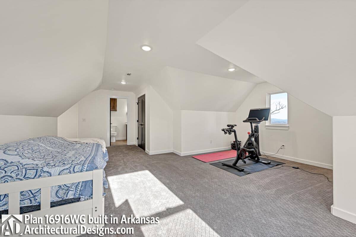 The spacious bonus room with a full bath is turned into a bedroom and gym.