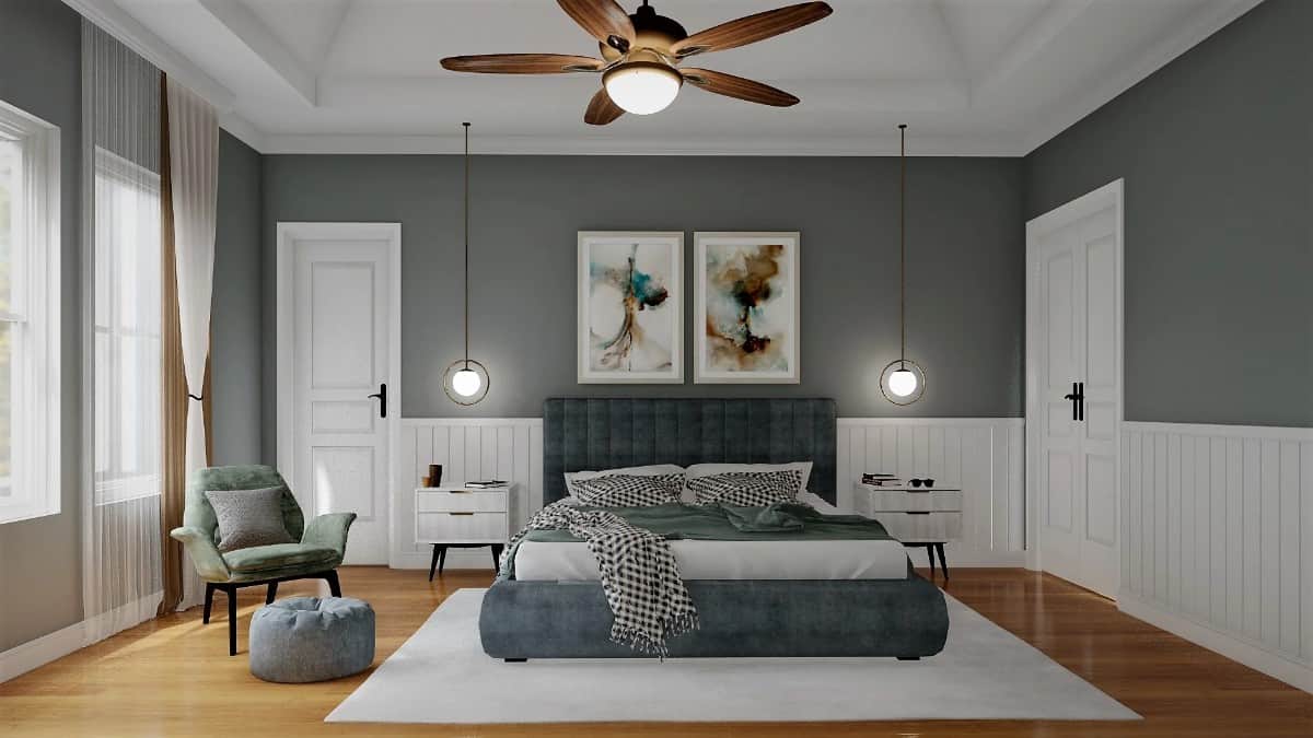 The primary bedroom features a tray ceiling and half beadboard walls that add soft contrast to the gray walls.