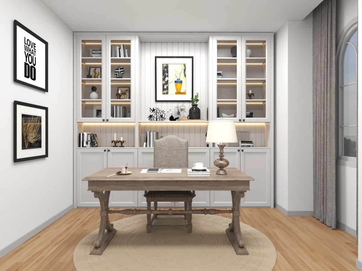 The home office has plenty of storage and a wooden desk that blends in with the hardwood floor.