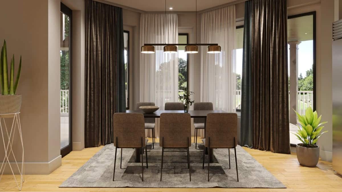 Breakfast nook with a bay window and a modern dining set topped with a linear chandelier.