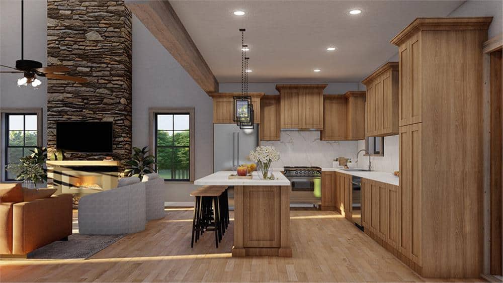 An oversized opening highlighted by a timber beam combines the great room and kitchen.