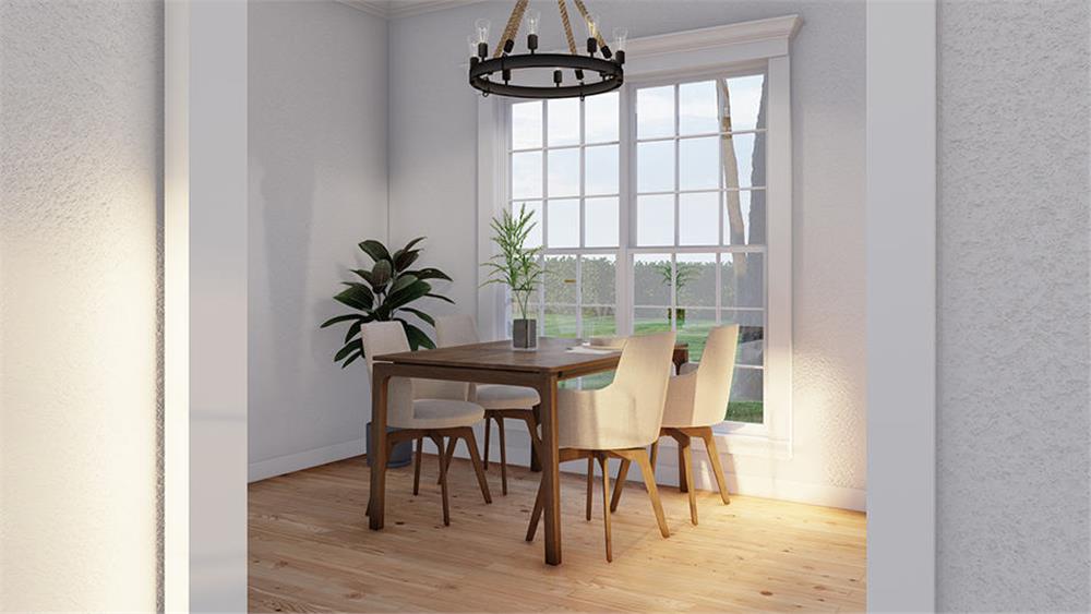 The dining room offers a wooden dining set and great views of the side yard.