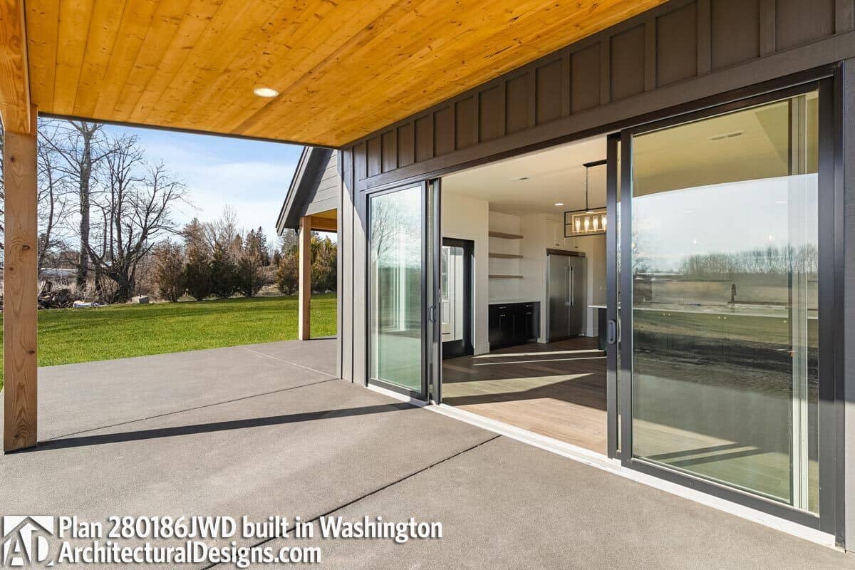 Sliding glass doors create seamless indoor-outdoor living.