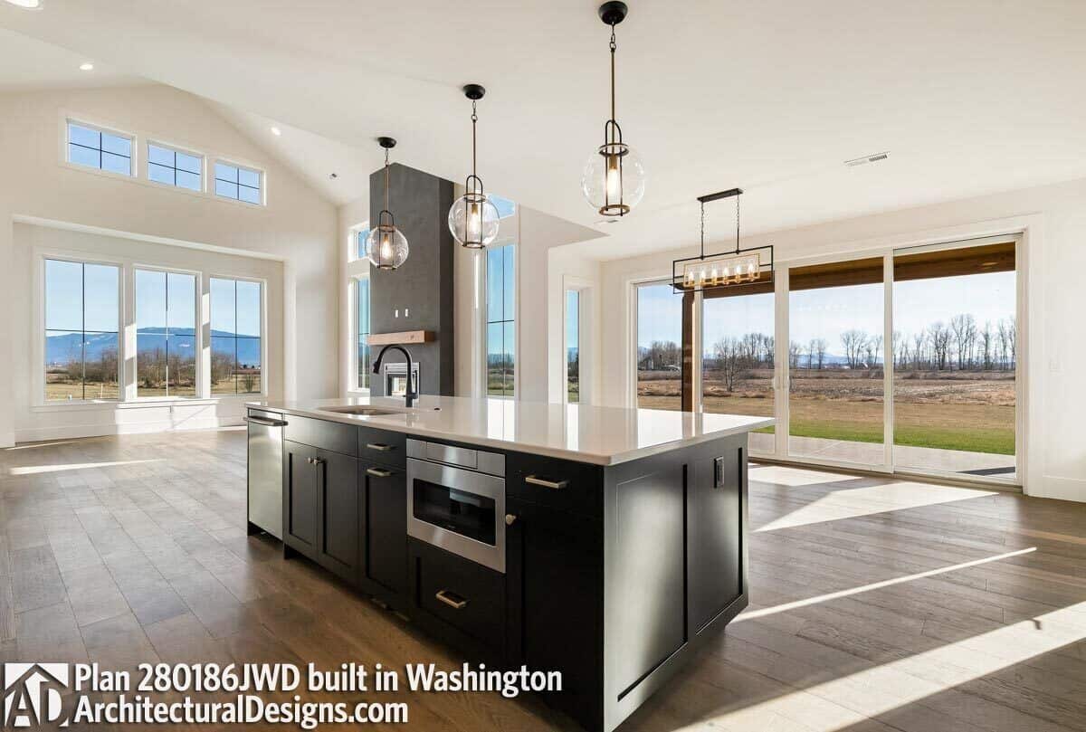 View of the vaulted great room and dining area from the kitchen.
