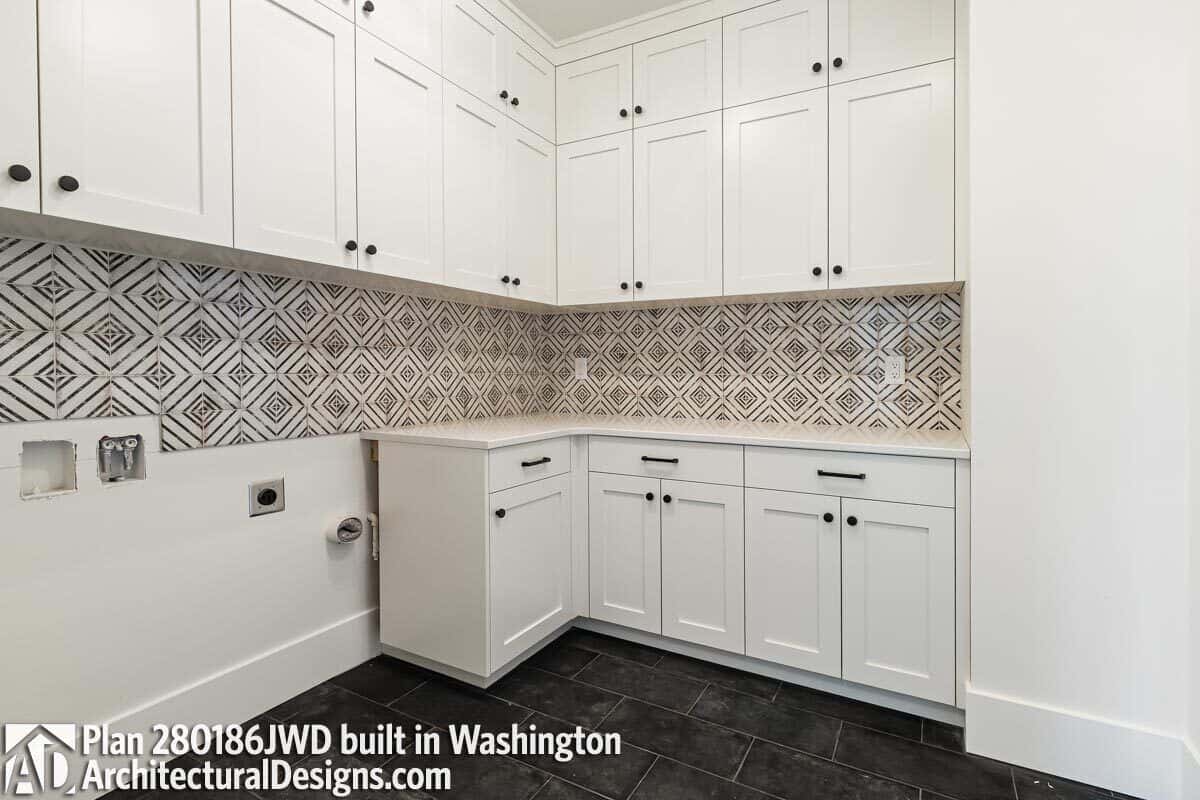 The laundry room offers lots of storage and counter space.