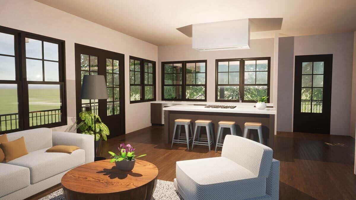 Combined living room and kitchen separated with a breakfast island.