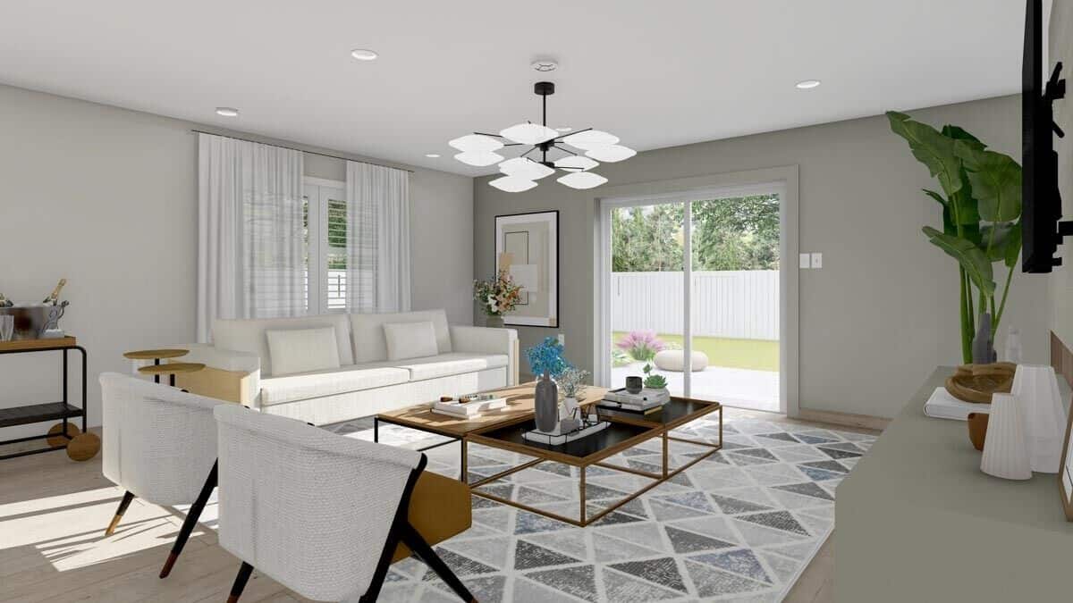 Family room with modern furnishings and sliding glass doors that open onto the back patio.