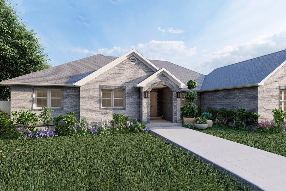 Front rendering with a stone exterior, multiple gables, and an arched entry.