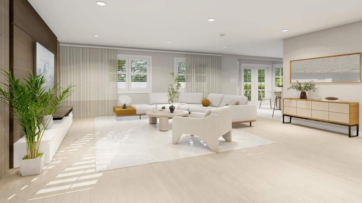 Louvered windows and a French door bathe the living space with ample natural light.