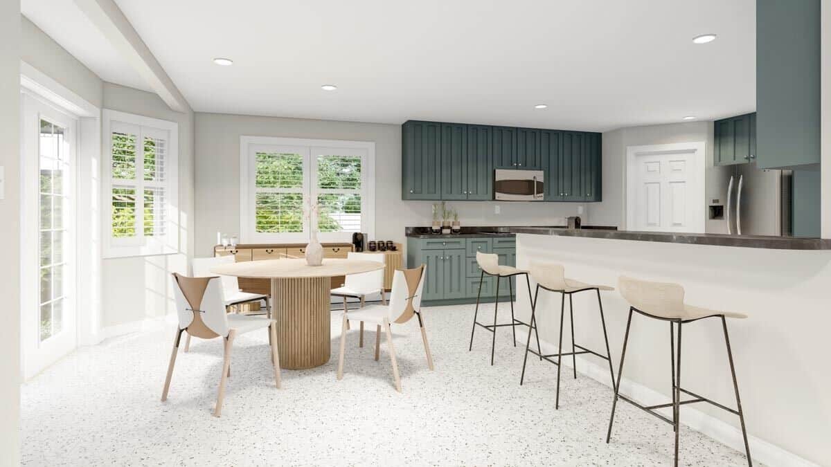 Eat-in kitchen with a peninsula bar that creates distinction between the dining area and kitchen.