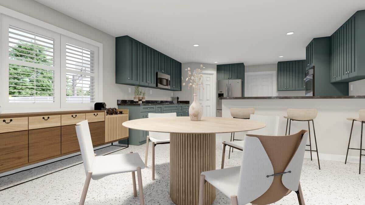 The dining area features a round wooden table paired with contemporary chairs.