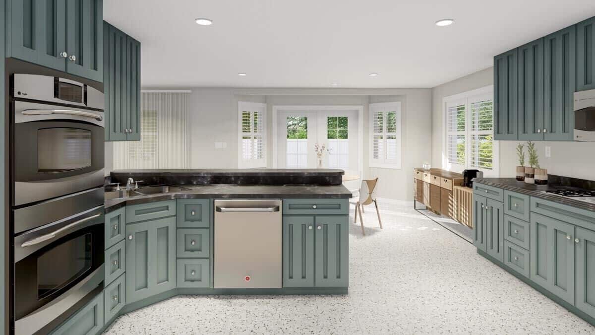 The kitchen overlooks the dining area and the rear patio beyond.