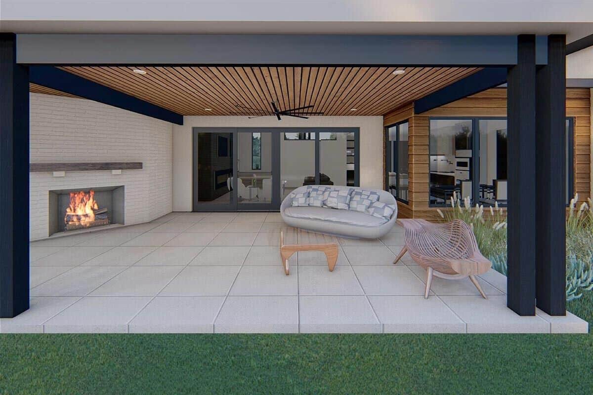 The covered porch includes wood-paneled ceiling and sliding glass doors that lead into the family room.