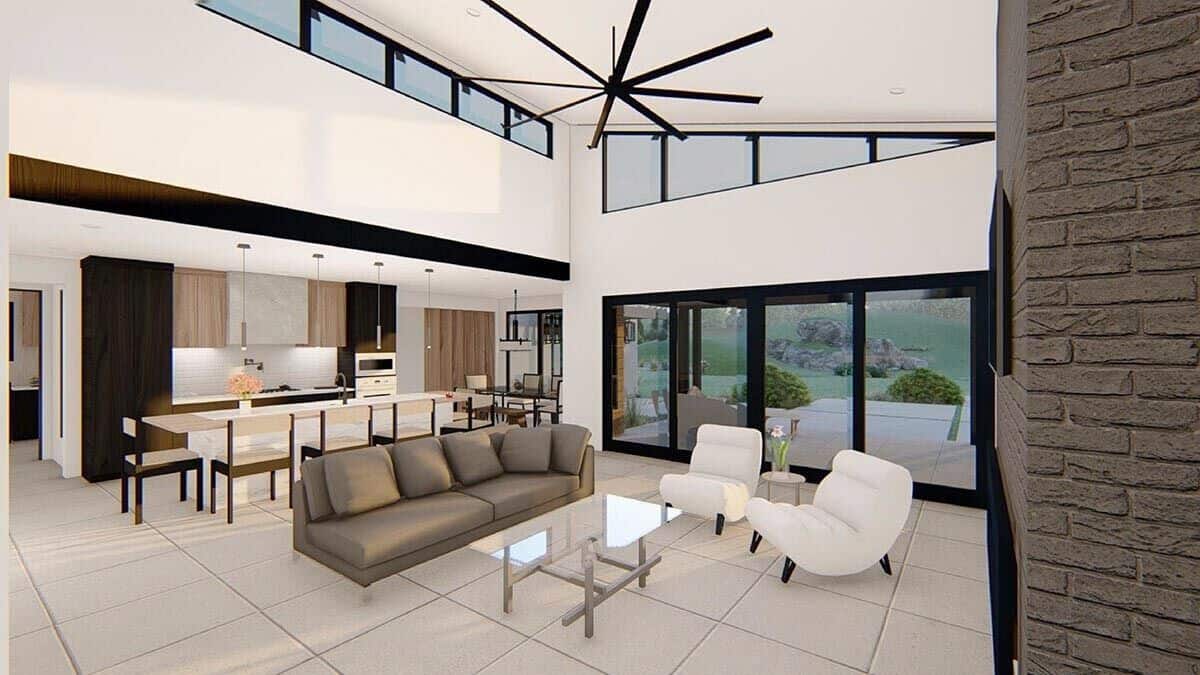 Clerestory windows and glass sliders bathe the open living space with natural light.