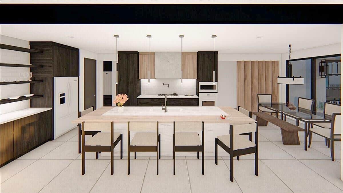 Eat-in kitchen with contrasting wood cabinets and a breakfast island with four additional seating.