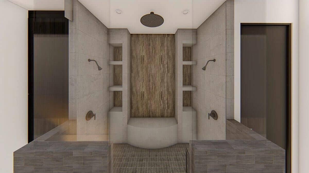Primary walk-in shower with built-in shelves, a bench, and multiple shower heads.
