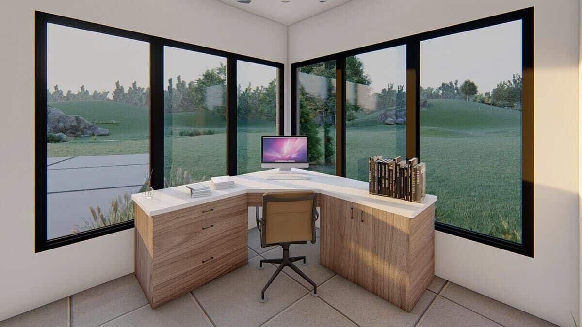 Corner windows provide the home office with sweeping views of the lush backyard.