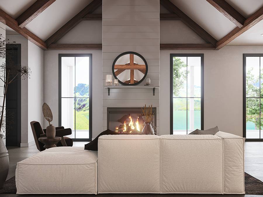 Living room with a large sofa and an electric fireplace topped with a round mirror.
