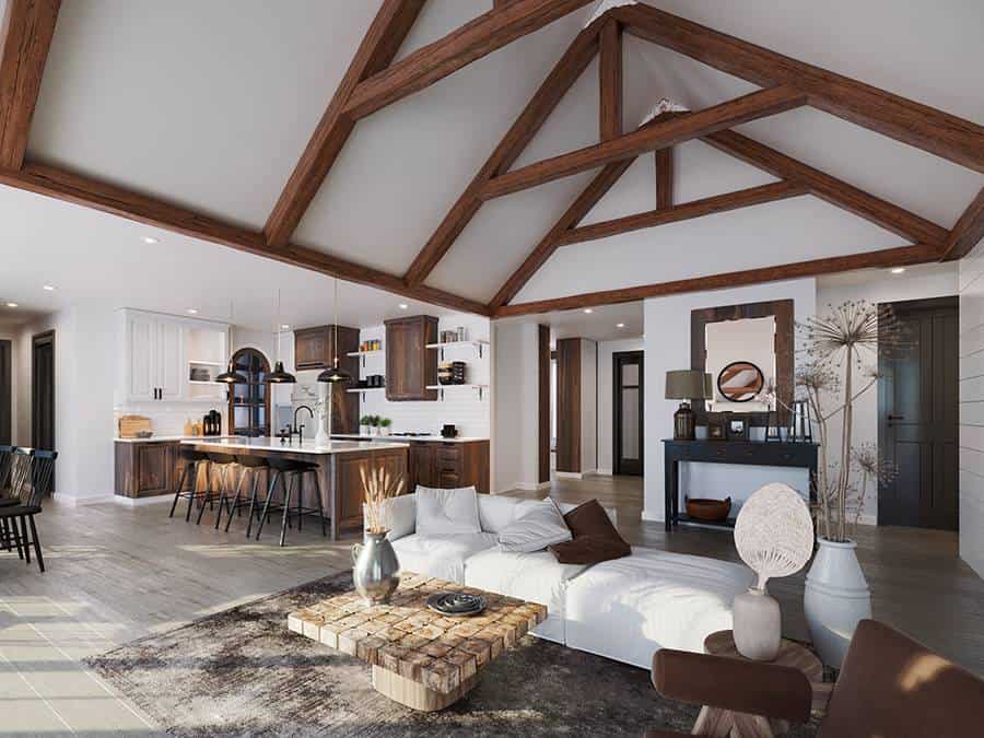 A cathedral ceiling framed with exposed trusses crowns the living room.