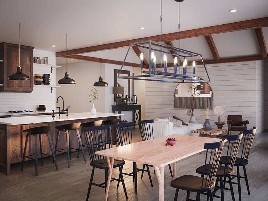 The dining area has a wrought iron chandelier and a light wood table paired with black chairs.
