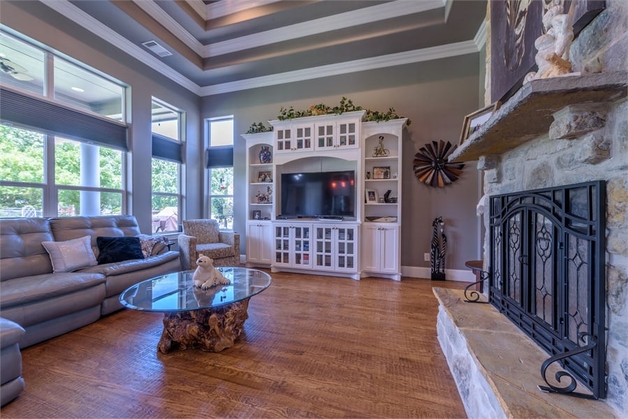 A wall of windows floods the family room with abundant natural light.