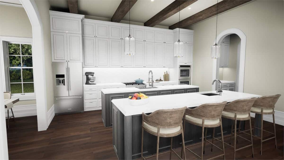 The kitchen offers plenty of storage and multiple islands under a beamed ceiling.