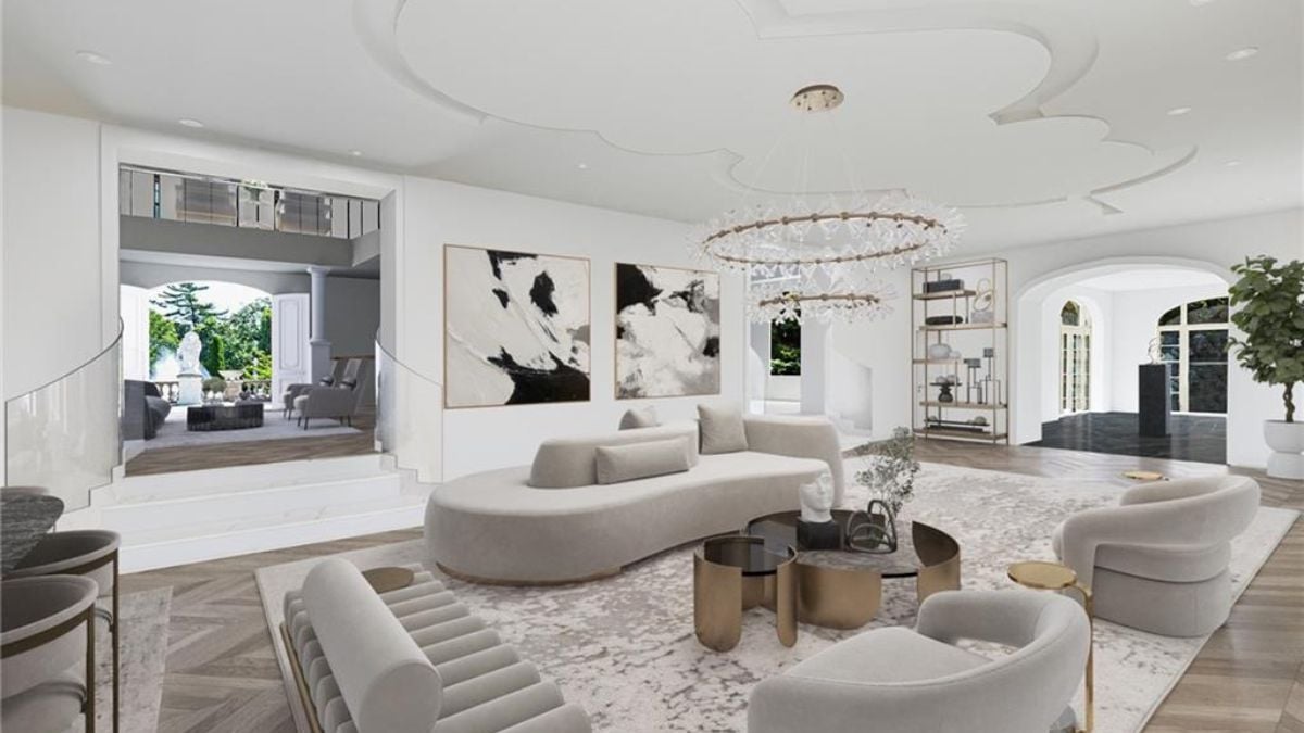 White and gray living room with crystallized chandelier.