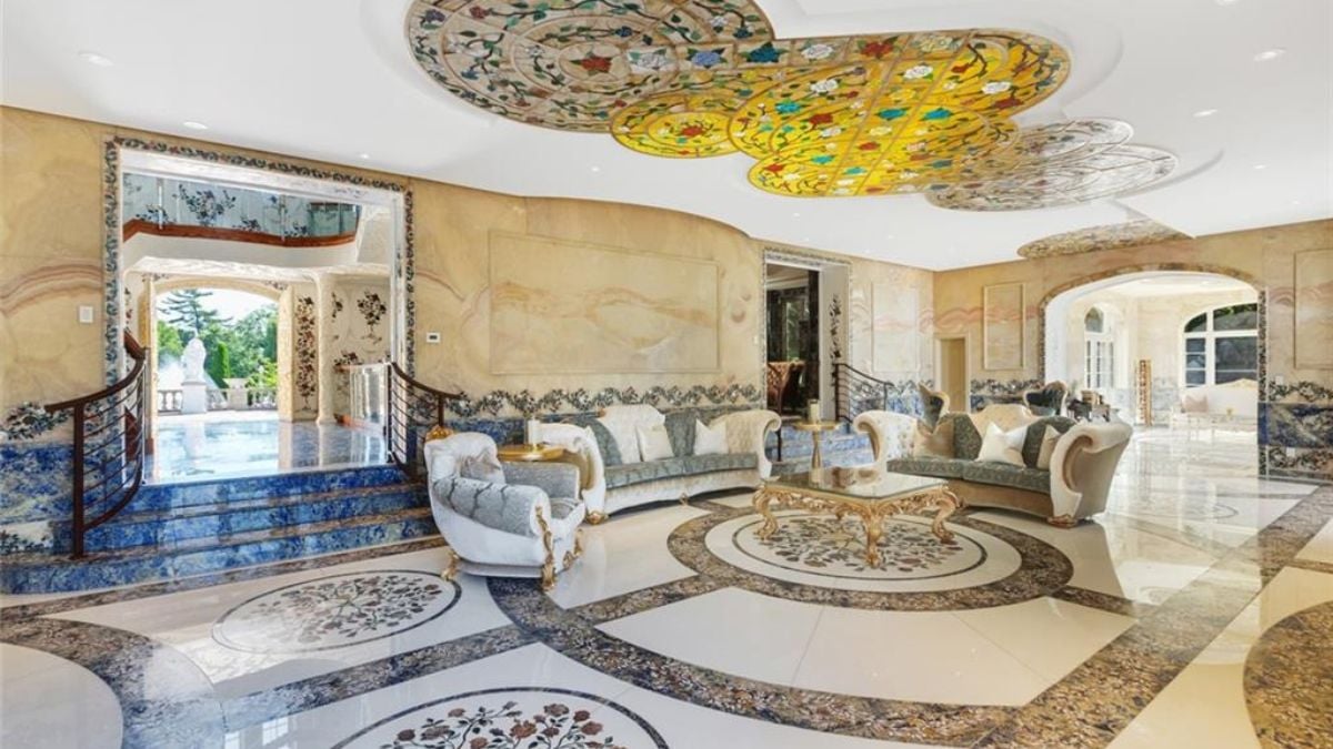 Golden themed living room with marble interiors.