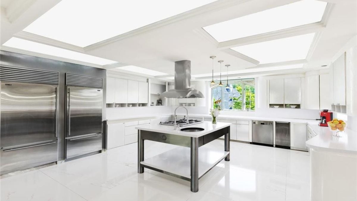 A stainless and white themed kitchen counter.