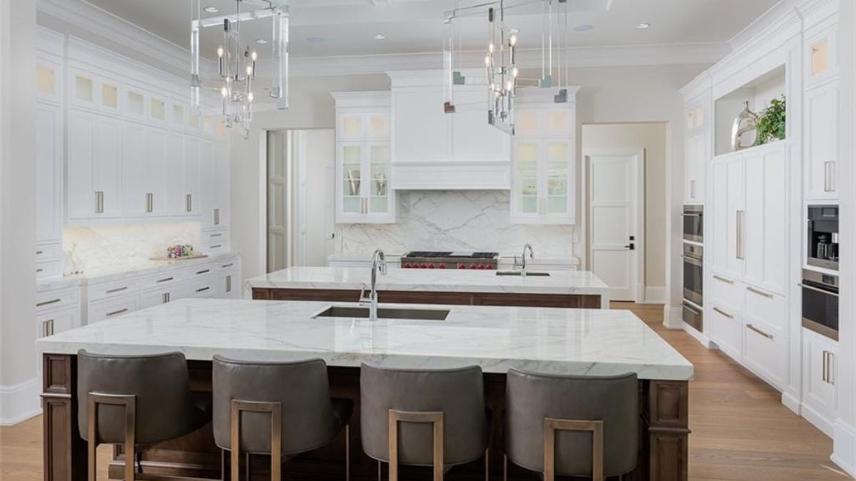 The view of white and brown motif of the kitchen.