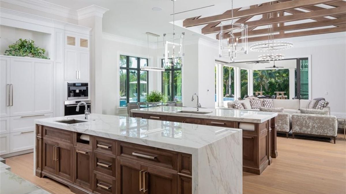 A mixed of marble and wood design kitchen with 2 separate sink.