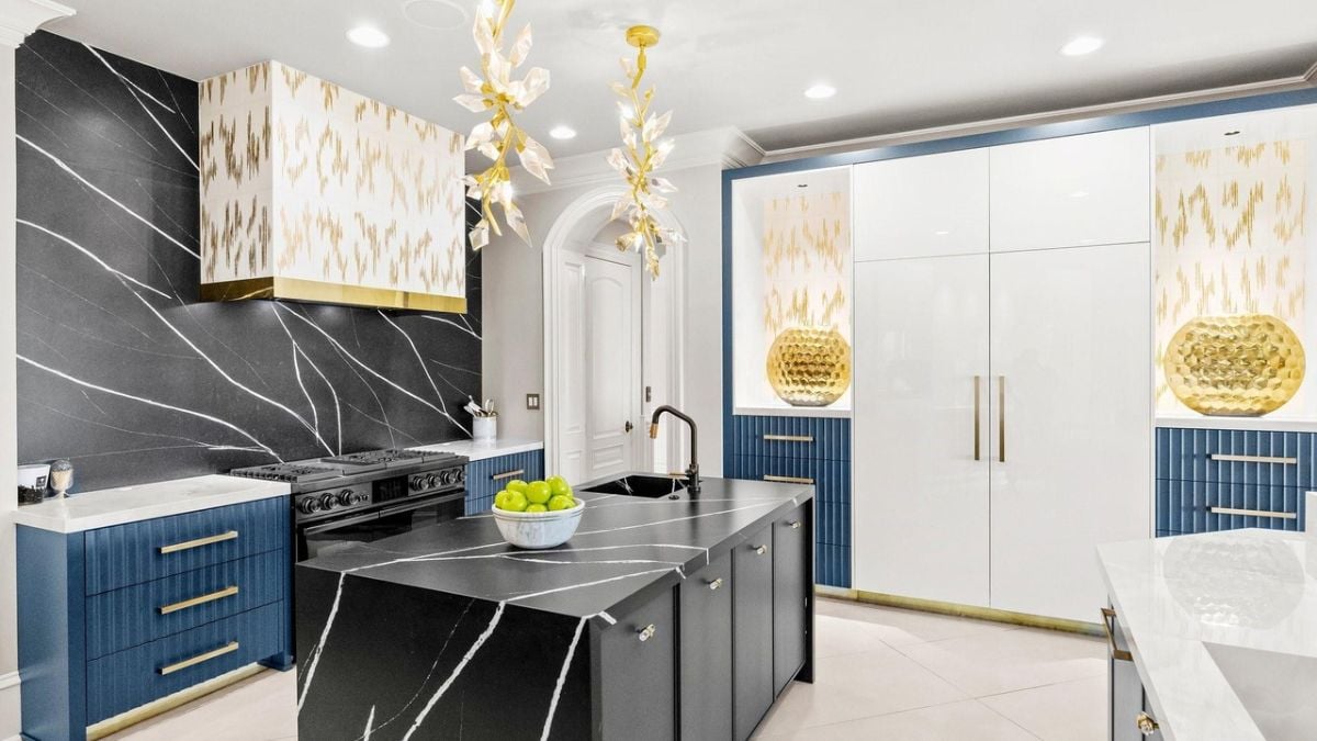 Black marble-designed sink and gas range