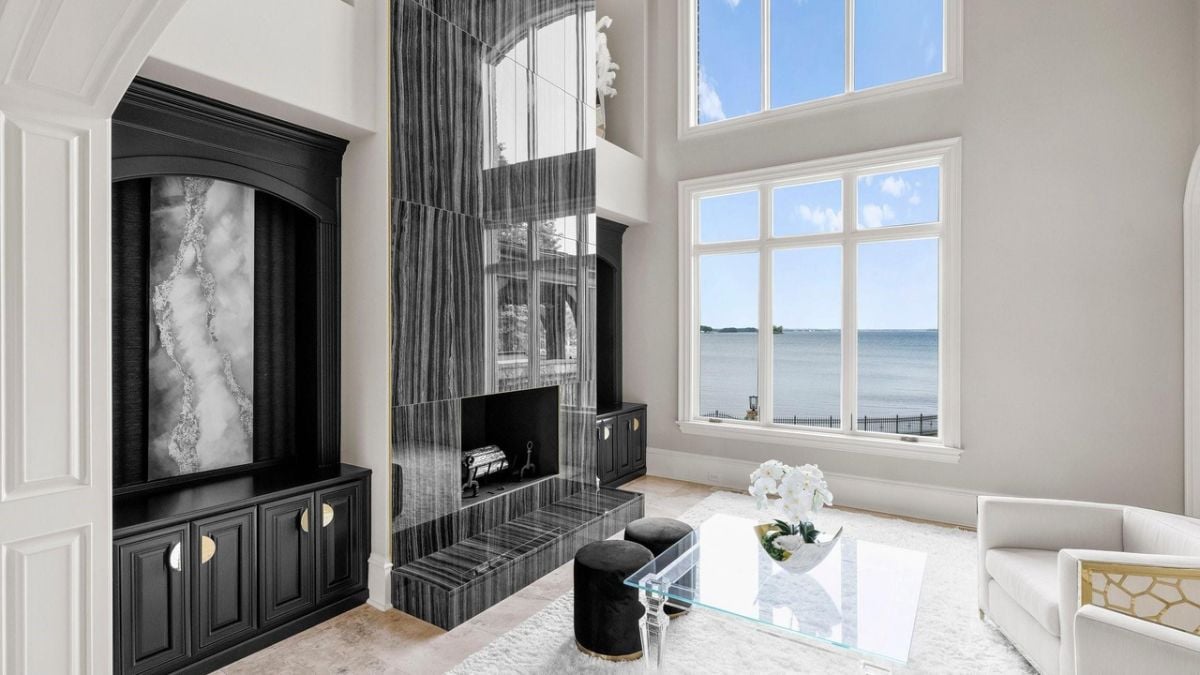 Modernized hearth with black and white couch
