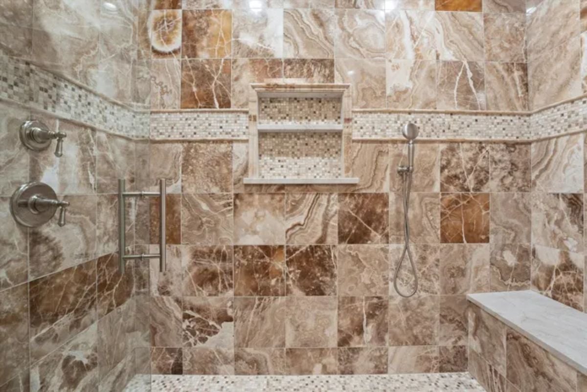 Limestone-tiled shower room