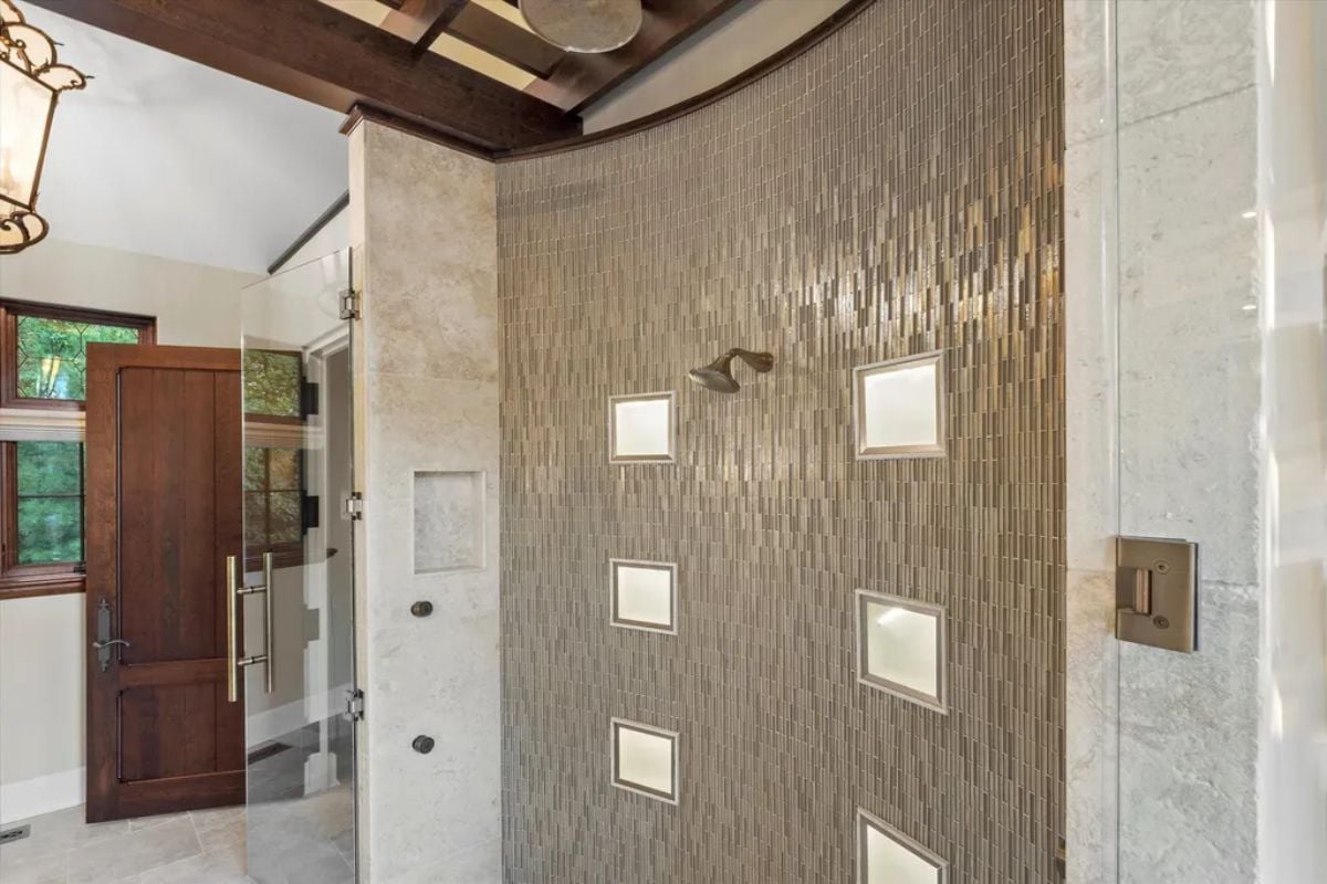 Limestone-tiled shower room wall