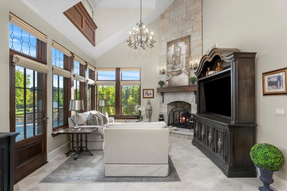 Living room with fireplace and chandelier