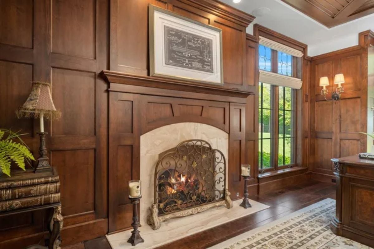 Fireplace surrounded by compartmentalized wooden cabinets