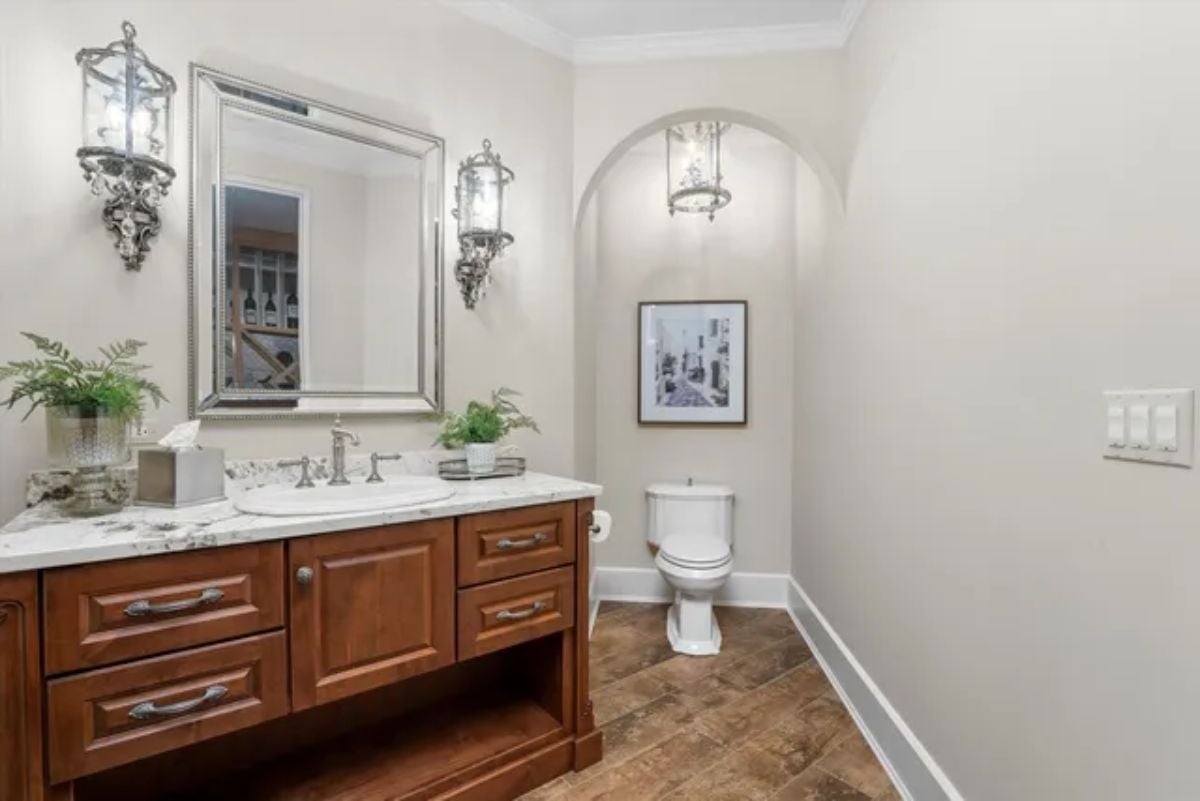 White bathroom and wooden-tiled sink