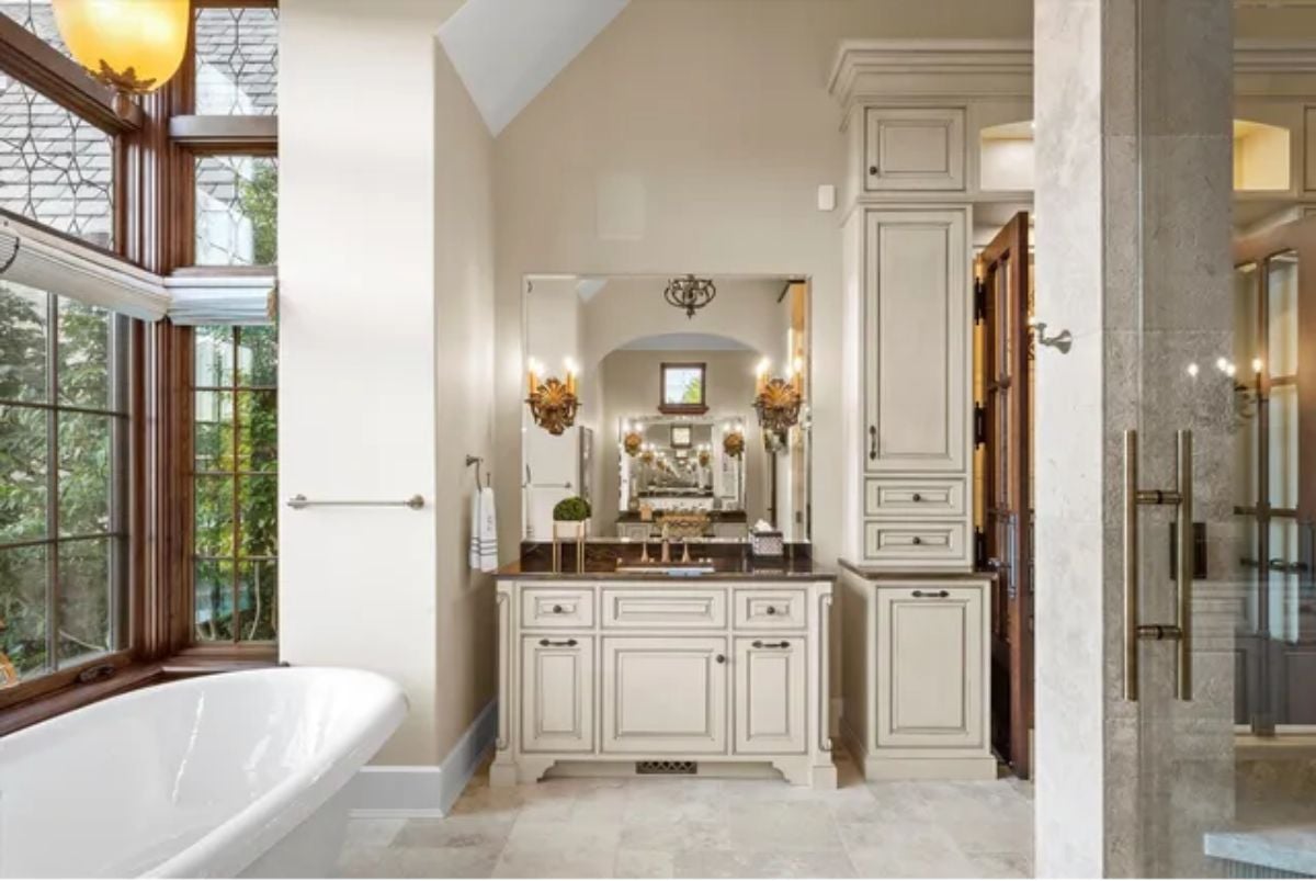 White bathroom with vanity mirror