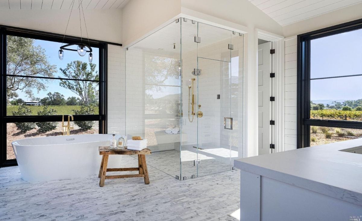 Bathroom with a shower and soaking tub.