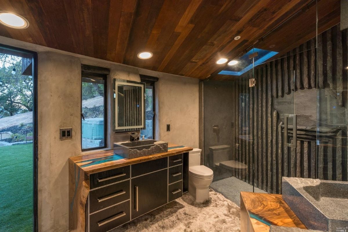 Bathroom with a shower, sink and toilet.